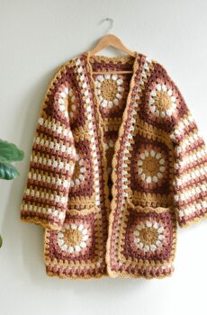Image of a granny square sweater with flowers.